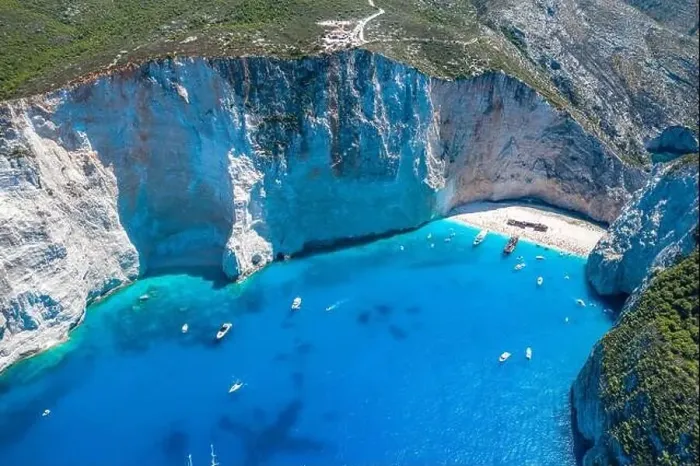 Framed Print : Aerial drone shot of Zakynthos Navagio beach with observation deck on cliff and yachts in summer Framed Print : Aerial drone shot of Zakynthos Navagio beach with observation deck on cliff and yachts in summer