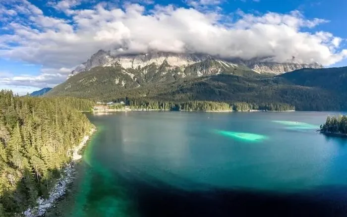 Framed Print : Aerial drone shot of Zugspitze covered with heavy fog by Eibsee Lake in Germany Framed Print : Aerial drone shot of Zugspitze covered with heavy fog by Eibsee Lake in Germany