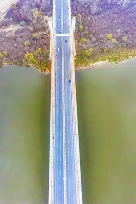 Framed Print : Aerial drone view. bridge in the rays of a sunny morning. Autumn haze in the air, cars are driving across the bridge Framed Print : Aerial drone view. bridge in the rays of a sunny morning. Autumn haze in the air, cars are driving across the bridge