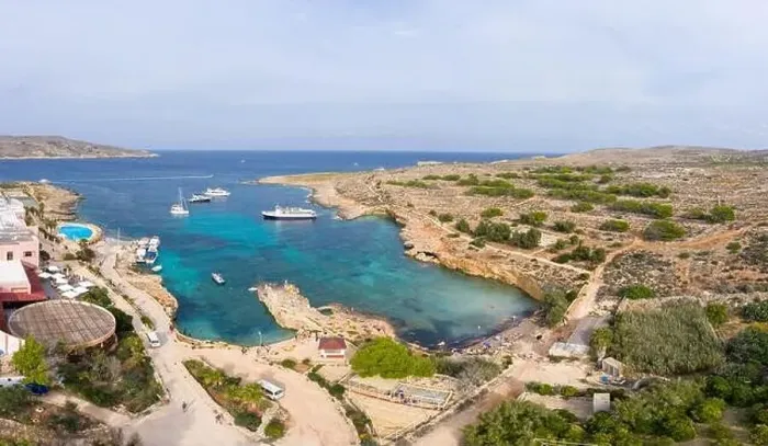 Framed Print : Aerial drone view Comino, Malta Blue Lagoon to enjoy the clear turquoise water with clear blue sky and boats in summer Framed Print : Aerial drone view Comino, Malta Blue Lagoon to enjoy the clear turquoise water with clear blue sky and boats in summer