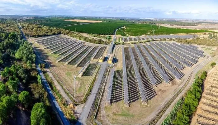 Framed Print : Aerial drone view of a farm of solar panels between crop fields Framed Print : Aerial drone view of a farm of solar panels between crop fields