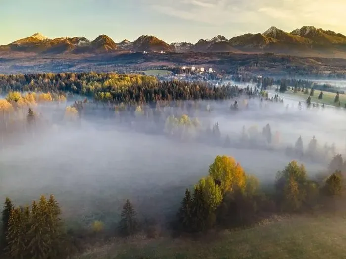 Framed Print : Aerial Drone View Over Fog and Mist at Sunrise in High Mountains. Autumn Tree Foliage Colors Framed Print : Aerial Drone View Over Fog and Mist at Sunrise in High Mountains. Autumn Tree Foliage Colors