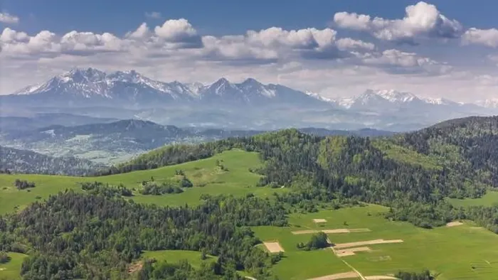 Framed Print : Aerial drone view over green hills of Pieniny National Park and snowy Tatra Mountains Framed Print : Aerial drone view over green hills of Pieniny National Park and snowy Tatra Mountains