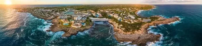Framed Print : Aerial drone view of the harbor, housing and the beach of Cala en Bosc on the Spanish island of Menorca Framed Print : Aerial drone view of the harbor, housing and the beach of Cala en Bosc on the Spanish island of Menorca