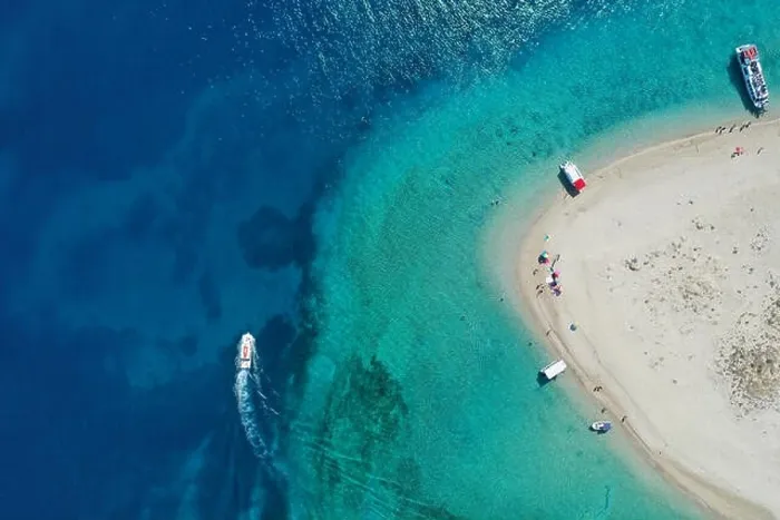 Framed Print : Aerial drone view of iconic small uninhabited island of Marathonisi featuring clear water, sandy shore and natural hatchery of Caretta-Caretta sea tur