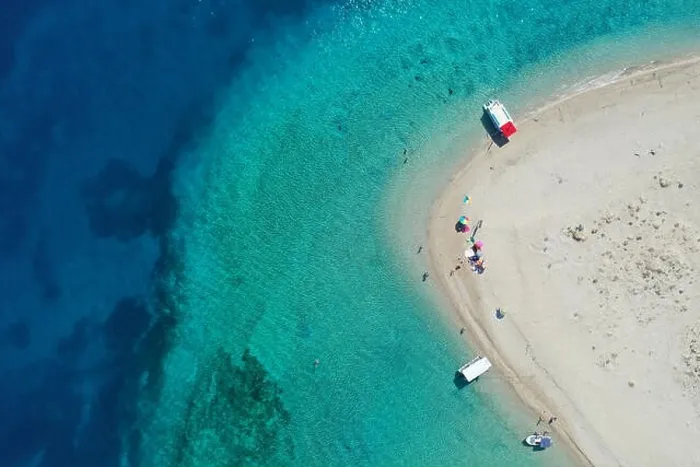 Framed Print : Aerial drone view of iconic small uninhabited island of Marathonisi featuring clear water, sandy shore and natural hatchery of Caretta-Caretta sea tur