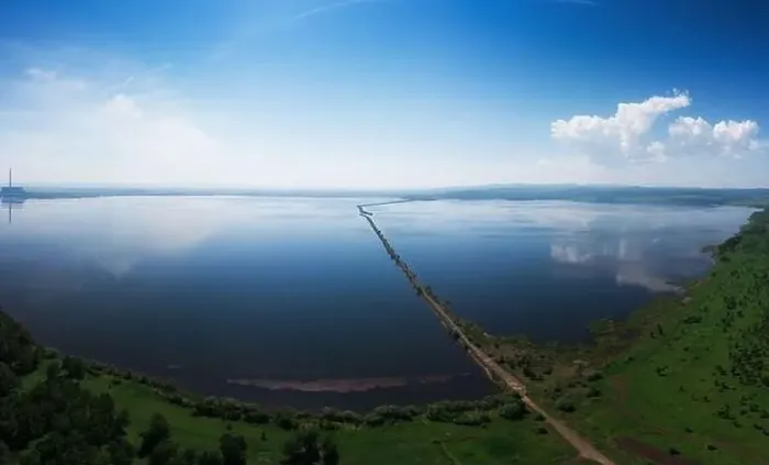 Framed Print : Aerial drone view of lake landscape with road Framed Print : Aerial drone view of lake landscape with road