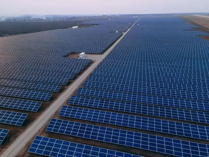Framed Print : Aerial drone view of large solar panels at a solar farm at bright spring windy sunset Framed Print : Aerial drone view of large solar panels at a solar farm at bright spring windy sunset