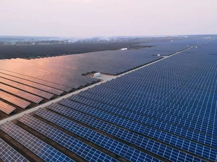 Framed Print : Aerial drone view of large solar panels at a solar farm at bright spring windy sunset Framed Print : Aerial drone view of large solar panels at a solar farm at bright spring windy sunset