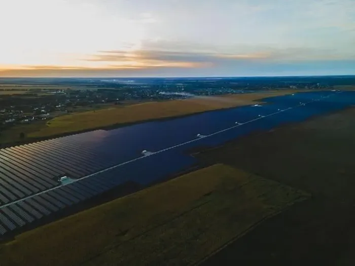 Framed Print : Aerial drone view into large solar panels at a solar farm in large field on countryside at bright sunset Framed Print : Aerial drone view into large solar panels at a solar farm in large field on countryside at bright sunset