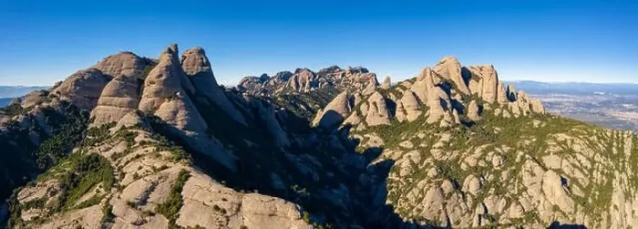 Framed Print : Aerial; drone view of multi-peaked mountain range near Barcelona; sunny winter cloudless day Framed Print : Aerial; drone view of multi-peaked mountain range near Barcelona; sunny winter cloudless day