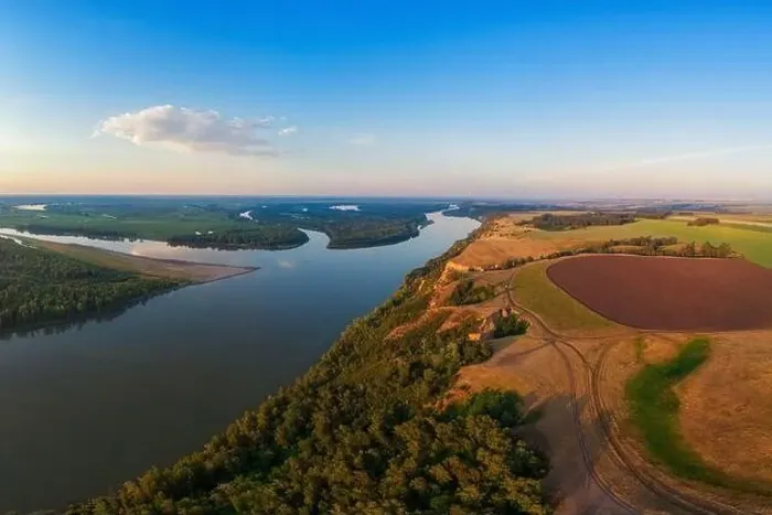 Framed Print : Aerial drone view of river landscape in sunny summer evening Framed Print : Aerial drone view of river landscape in sunny summer evening