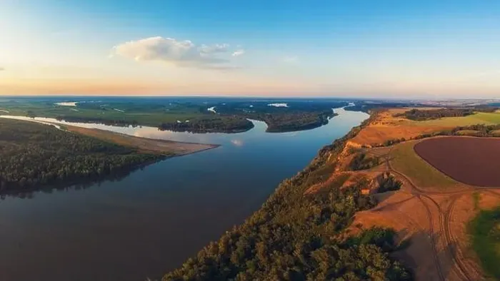 Framed Print : Aerial drone view of river landscape in sunny summer evening Framed Print : Aerial drone view of river landscape in sunny summer evening