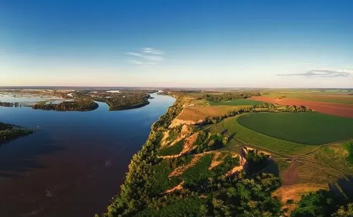Framed Print : Aerial drone view of river landscape in sunny summer evening Framed Print : Aerial drone view of river landscape in sunny summer evening