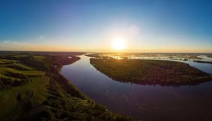 Framed Print : Aerial drone view of river landscape in sunny summer sunset Framed Print : Aerial drone view of river landscape in sunny summer sunset