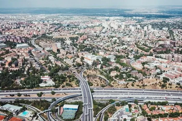 Framed Print : From above aerial drone view shot of city with dense infrastructure in Madrid, Spain Framed Print : From above aerial drone view shot of city with dense infrastructure in Madrid, Spain