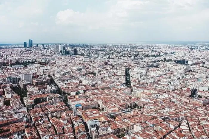 Framed Print : From above aerial drone view shot of city with dense infrastructure in Madrid, Spain Framed Print : From above aerial drone view shot of city with dense infrastructure in Madrid, Spain