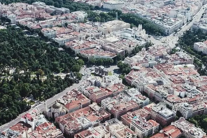 Framed Print : From above aerial drone view shot of city with dense infrastructure in Madrid, Spain Framed Print : From above aerial drone view shot of city with dense infrastructure in Madrid, Spain