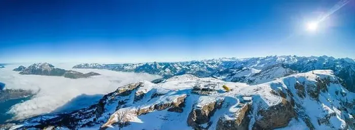 Framed Print : Aerial drone view of snow covered mountains and ski slopes, ski area Stoos, Switzerland Framed Print : Aerial drone view of snow covered mountains and ski slopes, ski area Stoos, Switzerland