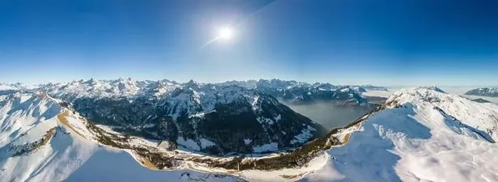 Framed Print : Aerial drone view of snow covered mountains and ski slopes, ski area Stoos, Switzerland