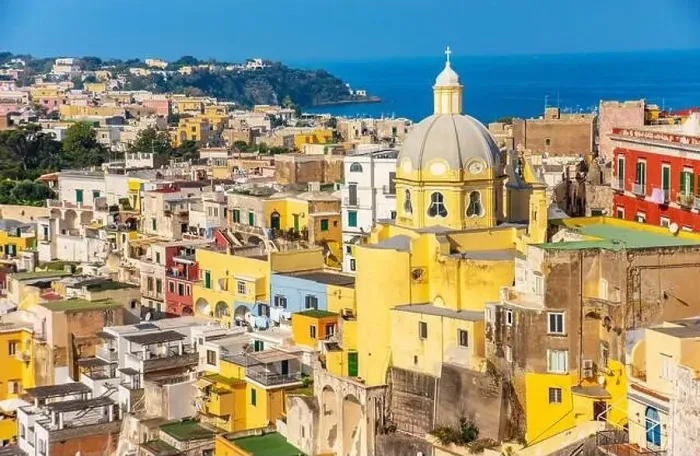 Framed Print : Aerial drone view of vibrantly colorful houses of Marina Corricella in sunny summer weather at Procida island, Italy Framed Print : Aerial drone view of vibrantly colorful houses of Marina Corricella in sunny summer weather at Procida island, Italy