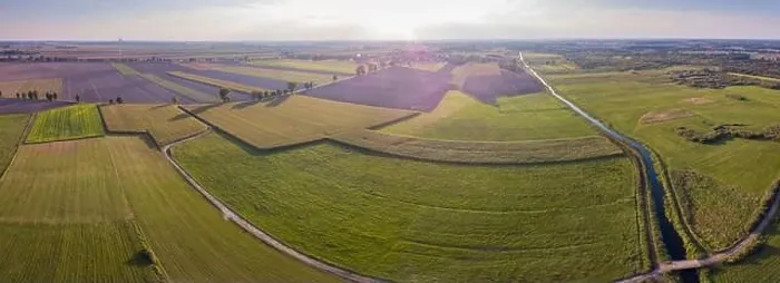 Framed Print : Aerial: FIelds and windmills in sunset light. Drone view Framed Print : Aerial: FIelds and windmills in sunset light. Drone view