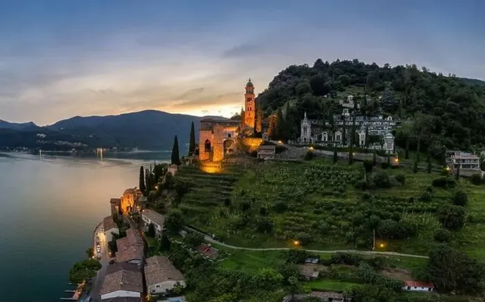Framed Print : Aerial image of the parish church Madonna del Sasso stands on the high hill of Vico Morcote at sunset Framed Print : Aerial image of the parish church Madonna del Sasso stands on the high hill of Vico Morcote at sunset