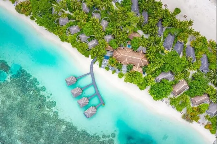 Framed Print : Aerial landscape from drone view blue water and wooden bridge and water villas with paradise island shore, sea coast palm tree. Stunning aerial travel Framed Print : Aerial landscape from drone view blue water and wooden bridge and water villas with paradise island shore, sea coast palm tree. Stunning aerial travel