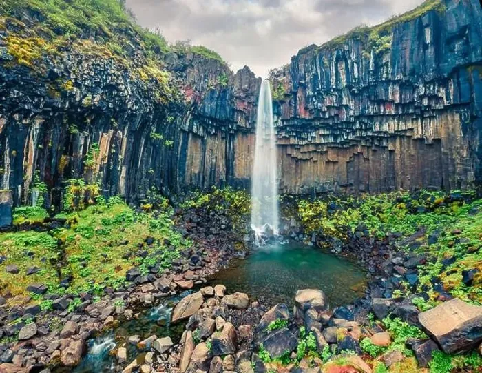 Framed Print : Aerial landscape photography. Fresh green view from flying drone of famous Svartifoss Waterfall Framed Print : Aerial landscape photography. Fresh green view from flying drone of famous Svartifoss Waterfall