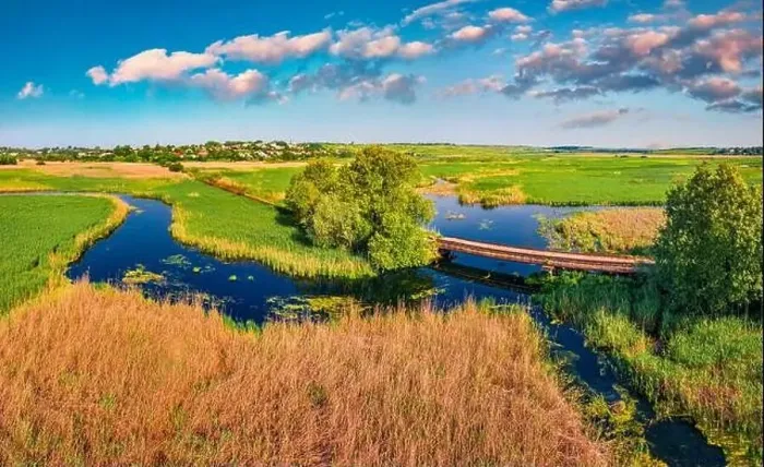 Framed Print : Aerial landscape photography. View from flying drone small of bridge over Seret river Framed Print : Aerial landscape photography. View from flying drone small of bridge over Seret river