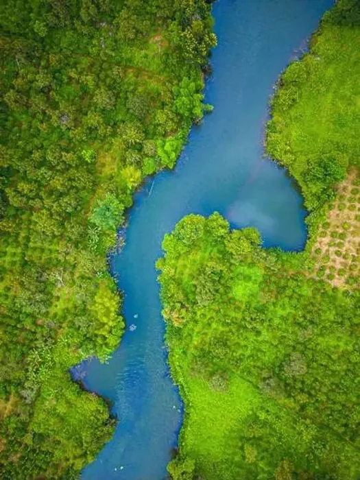 Framed Print : Aerial landscape of winding clear blue river in green field Framed Print : Aerial landscape of winding clear blue river in green field