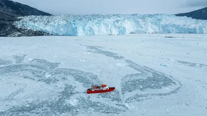 Framed Print : Aerial of a little ship floating between the ice below the Eqi glacier, Western Greenland, Denmark, Polar Regions Framed Print : Aerial of a little ship floating between the ice below the Eqi glacier, Western Greenland, Denmark, Polar Regions
