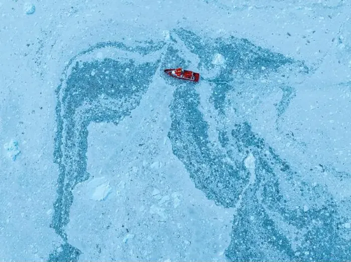 Framed Print : Aerial of a little ship floating between the ice below the Eqi glacier, Western Greenland, Denmark, Polar Regions Framed Print : Aerial of a little ship floating between the ice below the Eqi glacier, Western Greenland, Denmark, Polar Regions