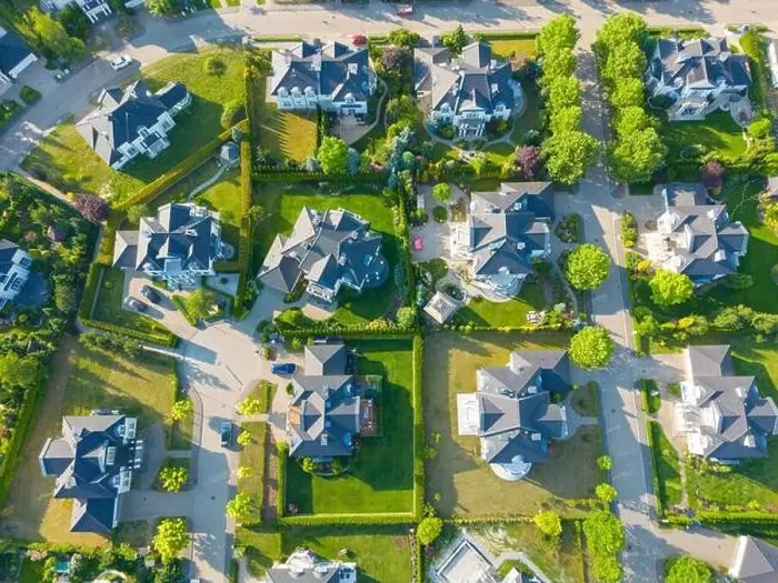 Framed Print : Aerial of new construction luxury residential neighborhood street single family homes real estate Framed Print : Aerial of new construction luxury residential neighborhood street single family homes real estate