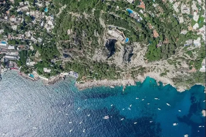 Framed Print : Aerial overhead drone shot of Aerial overhead drone shot of mountain top villa with pool above big mountain hole cave Framed Print : Aerial overhead drone shot of Aerial overhead drone shot of mountain top villa with pool above big mountain hole cave