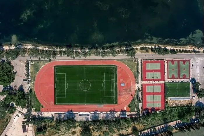 Framed Print : Aerial overhead drone shot of football field, tennis and basketball court in Argostolion, on Kefalonia Island Framed Print : Aerial overhead drone shot of football field, tennis and basketball court in Argostolion, on Kefalonia Island