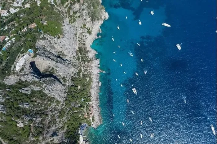 Framed Print : Aerial overhead drone shot of southern Capri Island coastline with mountain top pool and big hole underneath Framed Print : Aerial overhead drone shot of southern Capri Island coastline with mountain top pool and big hole underneath