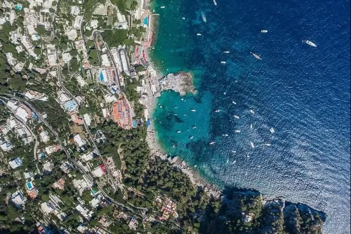 Framed Print : Aerial overhead drone shot of southern Capri Island coastline with yachts in summer noon Framed Print : Aerial overhead drone shot of southern Capri Island coastline with yachts in summer noon