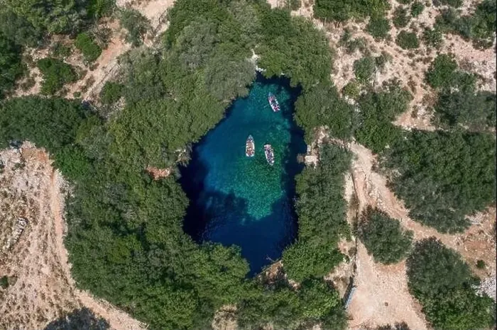 Framed Print : Aerial overhead drone shot of tourists boat in subterranean Melissani Lake Cave in Kefalonia Island Framed Print : Aerial overhead drone shot of tourists boat in subterranean Melissani Lake Cave in Kefalonia Island