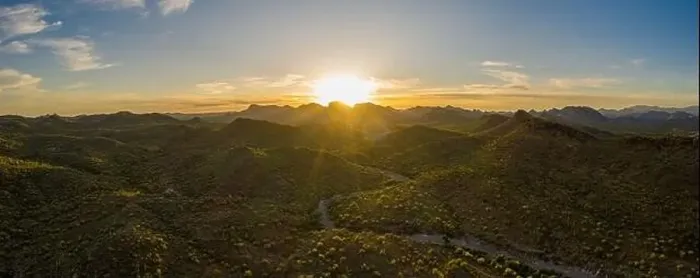 Framed Print : Aerial panorama over the Arizona desert during sunset with mountains and a meandering dry stream Framed Print : Aerial panorama over the Arizona desert during sunset with mountains and a meandering dry stream