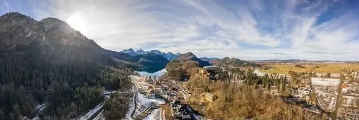Framed Print : Aerial panorama drone shot of Hohenschwangau by lake in Fussen with view of Alps snow mountain range in Germany winter Framed Print : Aerial panorama drone shot of Hohenschwangau by lake in Fussen with view of Alps snow mountain range in Germany winter
