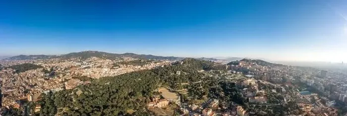 Framed Print : Aerial panorama drone shot of of hill near Barcelona city in morning hour with view of agbar tower in distatnt in Spain Framed Print : Aerial panorama drone shot of of hill near Barcelona city in morning hour with view of agbar tower in distatnt in Spain