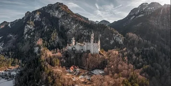 Framed Print : Aerial panorama drone shot of picturesque Neuschwanstein Castle on snowy hill in winter sunlight in Germany Framed Print : Aerial panorama drone shot of picturesque Neuschwanstein Castle on snowy hill in winter sunlight in Germany