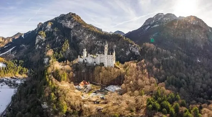 Framed Print : Aerial panorama drone shot of picturesque Neuschwanstein Castle on snowy hill in winter sunlight in Germany Framed Print : Aerial panorama drone shot of picturesque Neuschwanstein Castle on snowy hill in winter sunlight in Germany