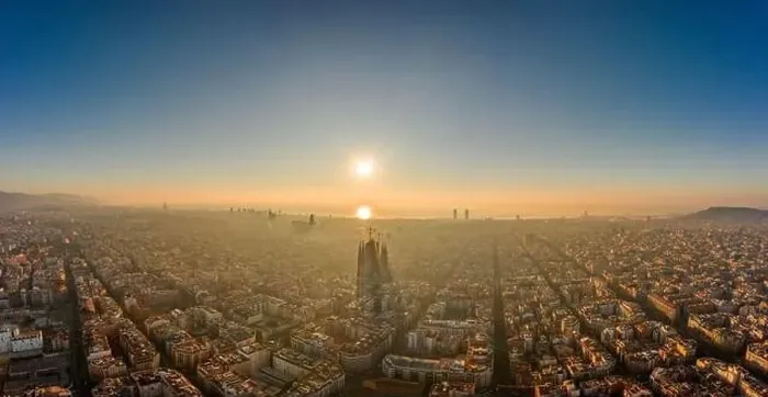 Framed Print : Aerial panorama drone shot of skyline in Barcelona city center in foggy sunrise golden hour in Spain winter Framed Print : Aerial panorama drone shot of skyline in Barcelona city center in foggy sunrise golden hour in Spain winter