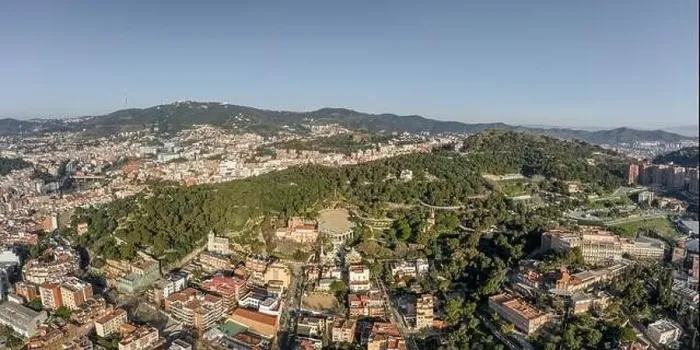 Framed Print : Aerial panorama drones shot of park on hill outside Barcelona city in Spain winter morning Framed Print : Aerial panorama drones shot of park on hill outside Barcelona city in Spain winter morning