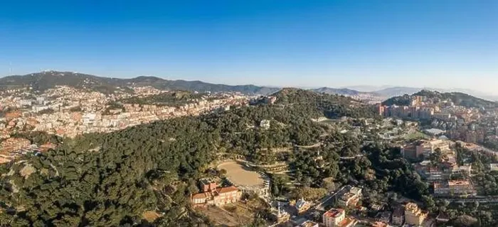 Framed Print : Aerial panorama drones shot of park on hill outside Barcelona city in Spain winter morning Framed Print : Aerial panorama drones shot of park on hill outside Barcelona city in Spain winter morning