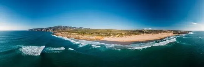Framed Print : Aerial panorama of Guincho Beach, Cascais, Portugal with Cabo da Roca visible on far right Framed Print : Aerial panorama of Guincho Beach, Cascais, Portugal with Cabo da Roca visible on far right