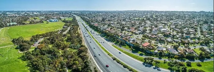 Framed Print : Aerial panorama of highway passing through suburban area on a sunny day in Melbourne, Australia Framed Print : Aerial panorama of highway passing through suburban area on a sunny day in Melbourne, Australia
