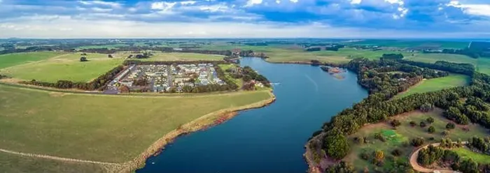 Framed Print : Aerial panorama of Hopkins River and holiday park surrounded by grasslands Framed Print : Aerial panorama of Hopkins River and holiday park surrounded by grasslands